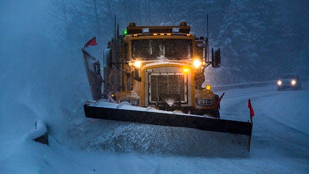 Photo of a snowplow clearing a highway