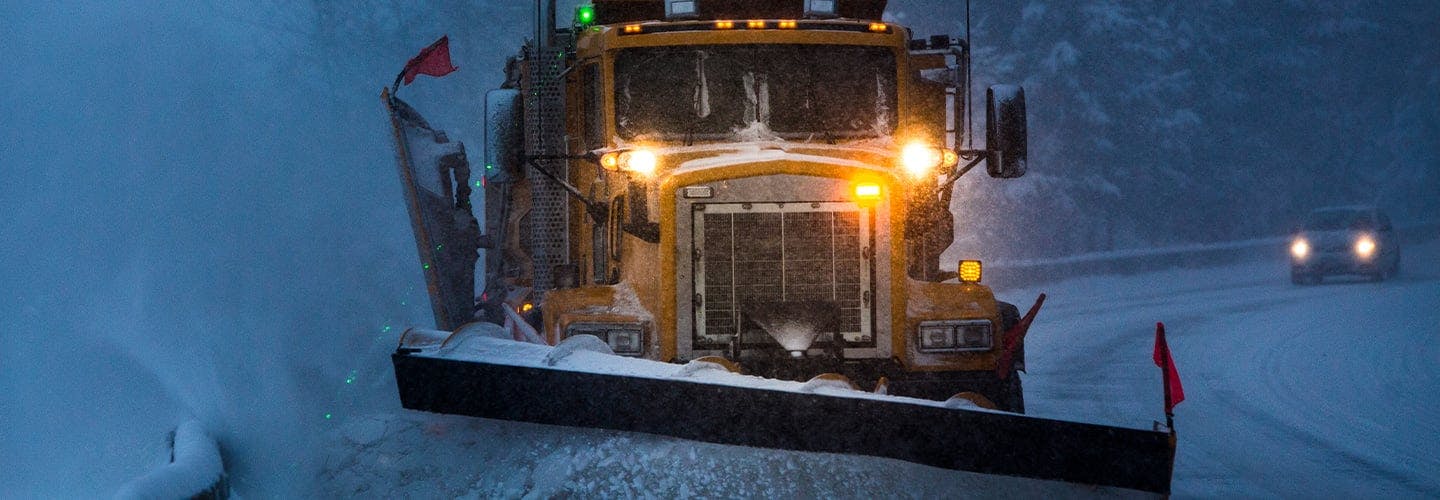 Photo of a snowplow clearing a highway