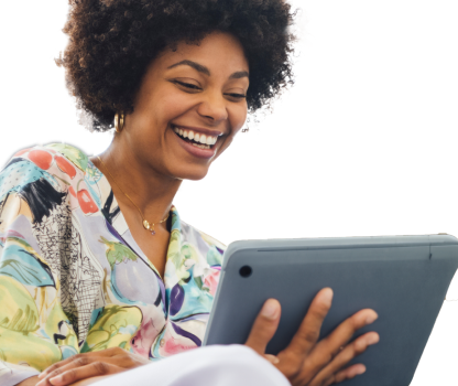A smiling woman holding a tablet.